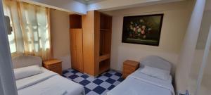 ALMajd Hotel客房内的一张或多张床位