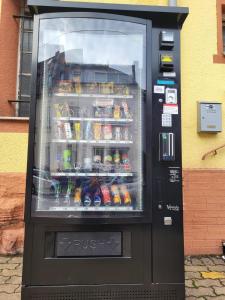 a vending machine with drinks and drinks in it at Stay2Night Hotel in Dillingen an der Saar