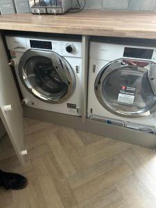 a washer and dryer under a counter in a kitchen at The Poplars in Bridlington