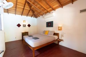a bedroom with a bed in a room at Babar Point in Arugam Bay