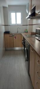 Kuchyň nebo kuchyňský kout v ubytování Apartamento ÉLITE en Cullera playa San Antonio