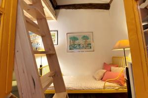 a bedroom with a bunk bed in a room at Oporto City Chalé in Porto