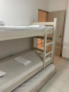 Postel nebo postele na pokoji v ubytování Cabaña 8 Arrecifes