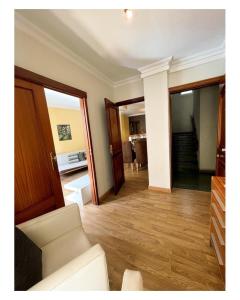 a living room with a white couch and a table at Dream Central Teatro in Santa Cruz de Tenerife