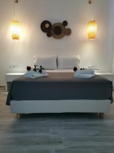 Postel nebo postele na pokoji v ubytování Galazio Rooms & Suites