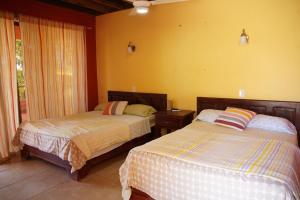 Postel nebo postele na pokoji v ubytování Hotel Punta Rusia