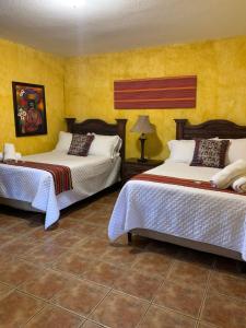 Tempat tidur dalam kamar di Casa El Conquistador