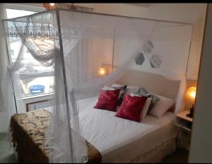 מיטה או מיטות בחדר ב-Flat bela vista master