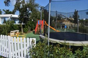 a playground with a slide and a play equipment at Agriturismo Alimini a Otranto in Otranto
