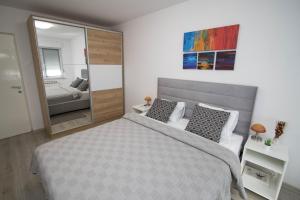 Posteľ alebo postele v izbe v ubytovaní Apartment IG4U, City center