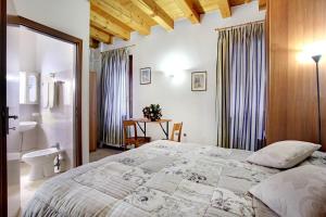 Postel nebo postele na pokoji v ubytování Locanda Delle Acque