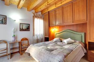 Postel nebo postele na pokoji v ubytování Locanda Delle Acque
