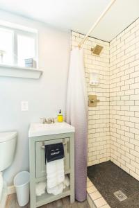 a bathroom with a sink and a shower at The Container Retreat @ 290 Wine Trail #1 Escape to Hye, TX in Hye