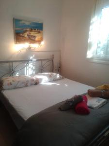 a bedroom with two twin beds with pillows at IOANNIS SEASIDE VILLA in Leptokarya