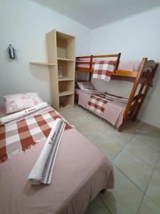a room with two beds in a room at Antunes vila maragogi in Maragogi
