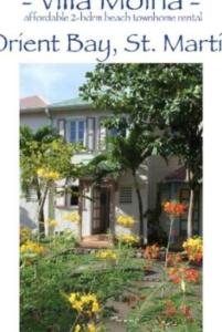 a book cover of a garden in front of a house at Beach house with nice private pool ,baie orientale in Orient Bay
