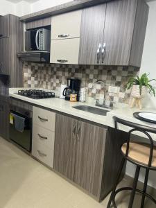 Majoituspaikan Acogedor apartamento en Itagui keittiö tai keittotila