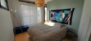 Postel nebo postele na pokoji v ubytování Maison Joli Soir à Ambleteuse
