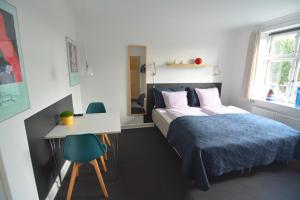 Postel nebo postele na pokoji v ubytování Billesgade Rooms
