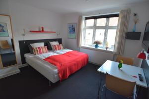 Postel nebo postele na pokoji v ubytování Billesgade Rooms