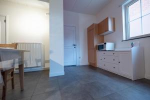 Kuchyň nebo kuchyňský kout v ubytování Vakantiewoningen Pomona