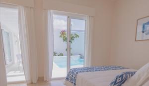 Posteľ alebo postele v izbe v ubytovaní Villa Tiguaro Piscina Climat Jacuzzy AC Villa 9 12