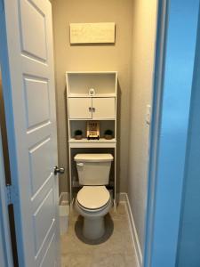 a bathroom with a toilet in a small room at New 3 story home *Seaworld/ Lackland in Helotes