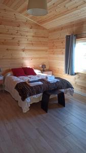 Postel nebo postele na pokoji v ubytování Las cabañas de Tino
