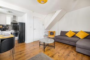 a living room with a couch and a table at Meersbrook Luxury Duplex Apartment in Sheffield