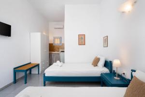 Postel nebo postele na pokoji v ubytování TA PLAGIA accommodation