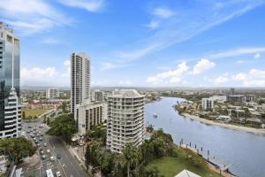 a view of a city with a river and buildings at Circle on Cavill - HR Surfers Paradise in Gold Coast