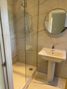 a bathroom with a shower and a sink at Jolly Sailors Retreat in Wells next the Sea