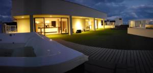 a large building with a bath tub in front of it at Hotel Praia Brava - Studios in Florianópolis