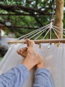 a person resting their hand on a hammock at Los Huertos Conect with the nature & relax in Icod de los Vinos