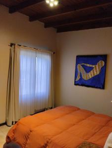 Una cama o camas en una habitación de SAN GONZALO