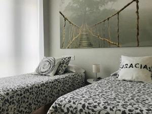 Katil atau katil-katil dalam bilik di Apartamento Singular Deluxe