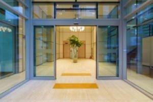 a room with a potted plant in the middle of a building at Kwangsu Hotel Haeundae in Busan
