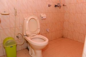 a bathroom with a toilet and a trash can at Little Heaven in Ella +29 photos