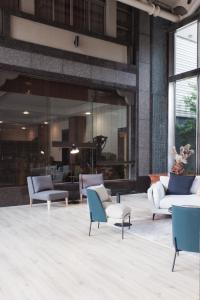 a lobby with couches and chairs in a building at East Coast Hotel in Hualien City