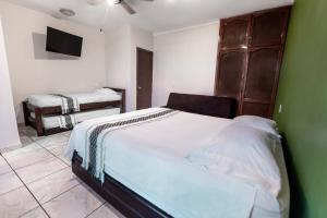 Postel nebo postele na pokoji v ubytování Habitación privada en el centro de Tequila
