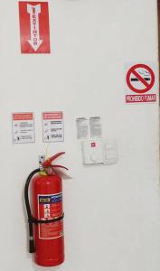 a red fire hydrant on a wall with signs at Dominican Suite 23, Incredible 1 Bed Apt (DS23) in San Felipe de Puerto Plata
