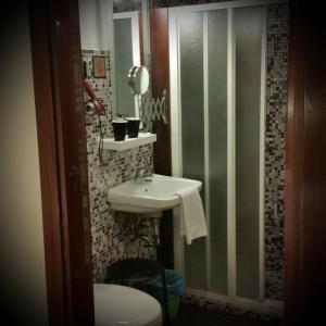 a bathroom with a sink and a toilet at B&B Venice 1964 in Venice +59 photos