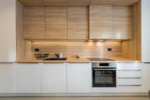 Kuchyň nebo kuchyňský kout v ubytování New Deluxe jacuzzi apartment Ana