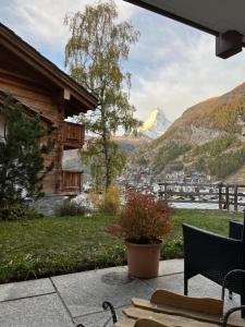 a patio with a view of a mountain at Millennium in Zermatt