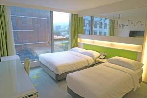 Cama o camas de una habitación en Dorsett Tsuen Wan, Hong Kong