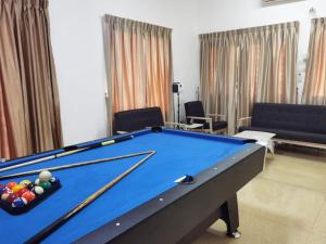 a pool table in a living room with at KSL Bungalow JBCC MidValley Mini Theater Pool CIQ in Johor Bahru