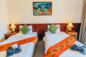 Postel nebo postele na pokoji v ubytování Krabi Sands Resort