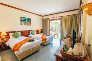 Postel nebo postele na pokoji v ubytování Krabi Sands Resort + 18 fotografií