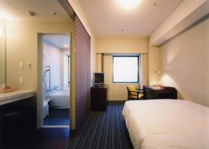 Кровать или кровати в номере Centrair Hotel