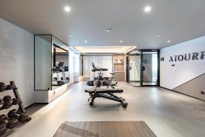 a gym with treadmills and exercise equipment in a building at Atour Hotel Bohai International Plaza Binzhou in Binzhou